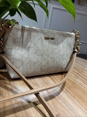 Calvin Klein Cream Monogram mini Crossbody Bag with Gold Hardware